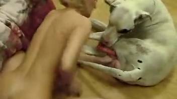 Stunning blonde orally pleasures a dog's pulsing cock
