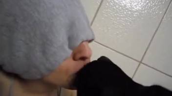 Guy obsessed with bestiality sporting a huge hard-on taught his pup to tongue a penis