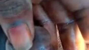 African guy films himself outdoors with a parasite shoved up his cock in nature scenes