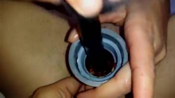 Sultry lady shoves bait worms into her moist cunt
