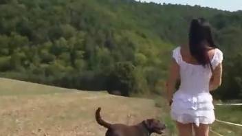 Slim babe lands a massive dog dick into her ass