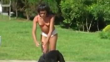 Nasty Latina with fancy headgear gets banged by a dog