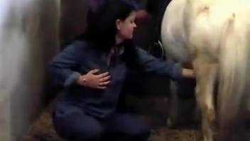 Incredible bestiality handjob by a stunning dark-haired vixen