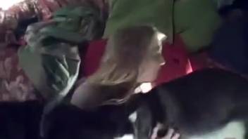 Tattooed bestiality enthusiast woman allows a canine to penetrate her