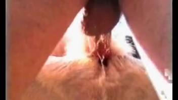 A pair engages with a goat in an outdoor steamy adult video.