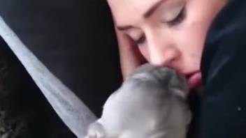 Sexy chick getting licked out by an adorable pup