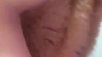 Stunning woman appearing in a video with a licking dog